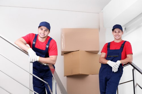 Removalists handling household furniture and boxes in Putney