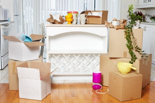 Packed office equipment ready for relocation in southwest London