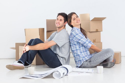 Packed boxes and furniture ready for transport in a Putney home move