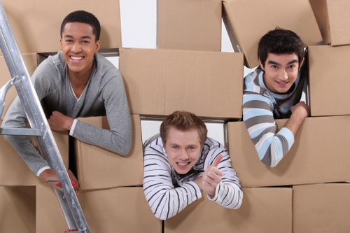 Local office removals team handling furniture in Putney