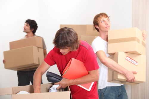 Removal crew loading items for a Putney flat or office move