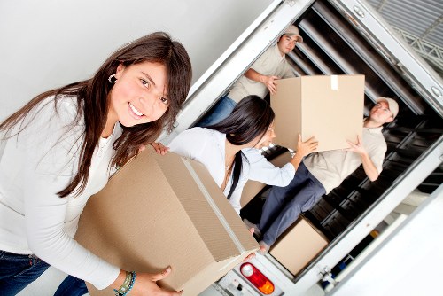 Loading furniture into a van during a Putney relocation