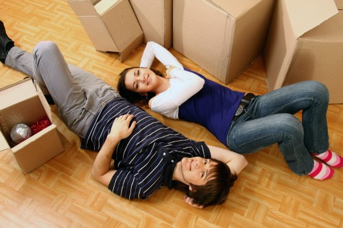 Family preparing boxes for a home move in Putney