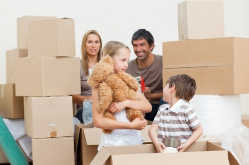 Professional moving van loading boxes and furniture in Putney